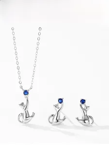 Detailed close-up of S925 sterling silver cat jewelry set with blue gemstone accents
