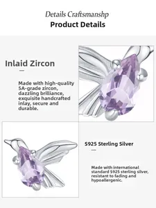 Macro view of hummingbird pendant with purple pear-shaped zirconia in 925 sterling silver