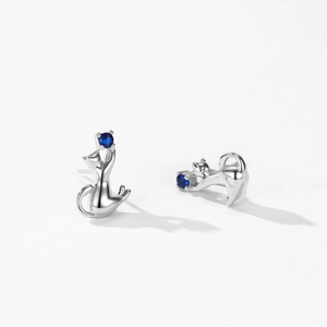 Cute S925 sterling silver cat earrings with blue gemstones shown on white background