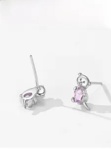 Macro detail of 925 sterling silver koala studs with pink oval gemstone settings