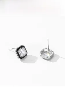 Detail showing S925 sterling silver stamp and square zircon with black enamel frame