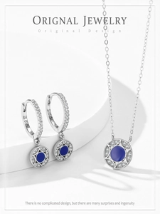 Macro shot of S925 sterling silver stamp and blue enamel star pendant jewelry set