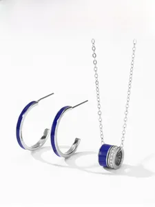 Detail of 925 silver jewelry set with royal blue enamel and sparkling pavé accents