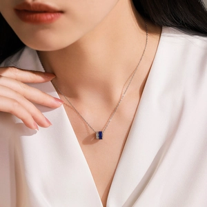Elegant 925 silver necklace featuring a blue enamel cylinder pendant with sparkling zircons