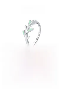 Detail shot of the S925 sterling silver ring featuring green enamel leaf branch designs