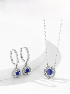 Detailed macro view of S925 sterling silver jewelry set with blue enamel and white zircon stones