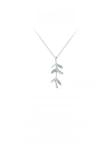Detail view of 925 sterling silver branch necklace with green enamel leaves on white background