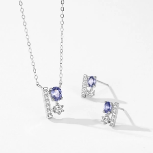 Parure en argent 925 avec pierres ovales violettes et boucles d'oreilles verticales