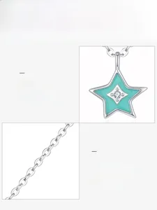 Detail of 925 sterling silver star pendant with green enamel and central zircon stone