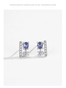 Close-up of s925 silver stud earrings with purple tanzanite-style cubic zirconia stones
