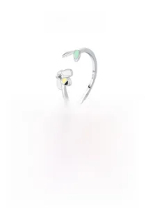 Detailed macro view of S925 sterling silver honeybee and green enamel leaf on open ring