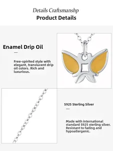 Detailed close-up of 925 sterling silver butterfly pendant with yellow enamel inlay