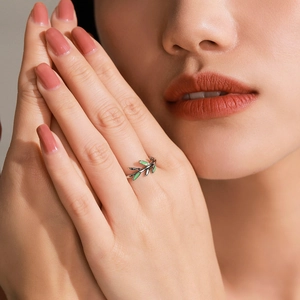 S925 silver ring featuring green enamel olive leaves on a nature-inspired branch band