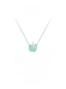 Detailed macro view of the silver apple pendant with green enamel and zircon leaf