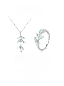 Detail of S925 sterling silver sprout necklace and ring set with green enamel leaves