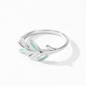 925 Sterling silver branch ring with green enamel leaves on a white background