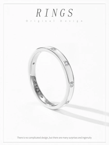 Detail shot of S925 sterling silver stamp and zircon stones on minimalist white ring