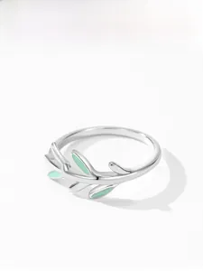 Detailed view of S925 silver leaf ring with light green enamel leaf detail