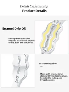 Macro view of S925 sterling silver twisted ring with yellow enamel and zircon detail