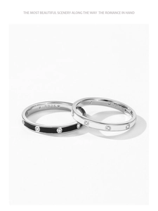 Close-up of S925 sterling silver stamp and sparkling gems on black enamel rings