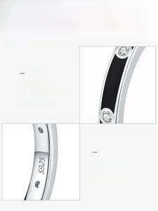 Macro detail of S925 sterling silver ring with black enamel and zircon stones inlay