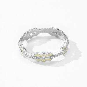 925 silver wavy ring with yellow enamel and zircon stones in a macro top-down view