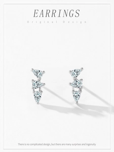 Detail shot of 925 silver stud earrings featuring three tiered pear-cut cubic zirconia