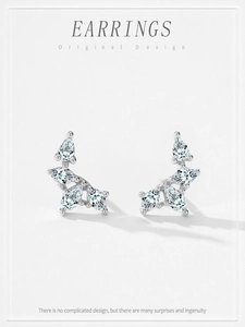 Detailed view of S925 sterling silver wing earrings with pear and marquise cut zircons