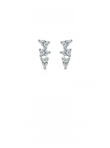 Macro detail of 925 sterling silver earrings with three tiered pear-cut zircons
