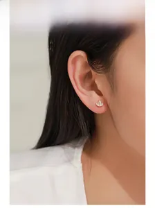 Detailed view of 925 silver gold crown stud earring with three marquise-cut zircons