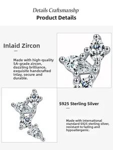Close-up of S925 sterling silver wing earrings featuring hand-set 5A cubic zirconia
