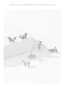 Close-up of S925 sterling silver wing and butterfly earrings with sparkling cubic zirconia