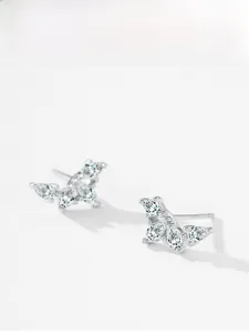 Detail view of silver wing earrings featuring four marquise-cut marquise zircon stones