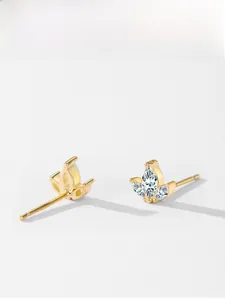 Detailed view of gold crown stud earrings featuring sparkling marquise cut crystals