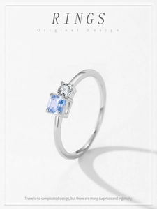 Detail of S925 sterling silver ring featuring light blue square and round crystals