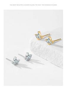 Detail view of S925 sterling silver crown stud earrings with sparkling marquise cut diamonds