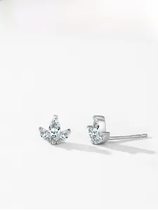 Macro detail of S925 sterling silver crown stud earrings with marquise-cut marquise stones