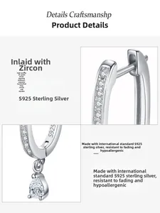 Detail of 925 sterling silver U-shaped hoop earrings with 5A zircon teardrop charms