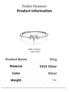 Macro detail of S925 sterling silver triangle ring with inset clear gemstones