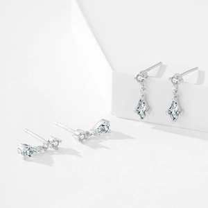 925 sterling silver drop earrings with faceted zircon stones on a white stand
