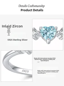 Detailed view of S925 sterling silver stamp and heart-shaped blue cubic zirconia