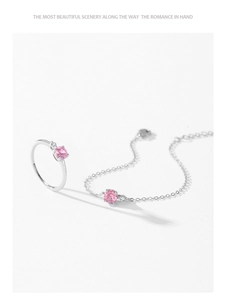 Macro view of S925 sterling silver ring and bracelet set with pink stones