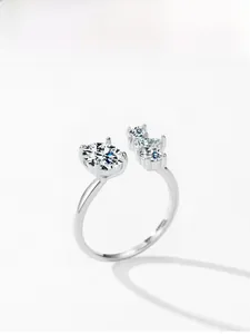 Macro view of adjustable 925 sterling silver ring featuring oval solitaire and accent diamonds