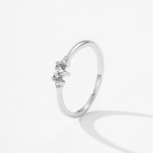 Elegant 925 sterling silver ring with three triangle-set round diamonds on a slim band