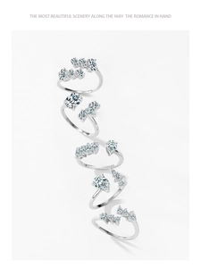 Detailed view of five S925 sterling silver open rings with marquise and pear crystals