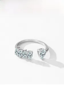 Macro detail of 925 silver ring featuring five sparkling pear-shaped teardrop stones