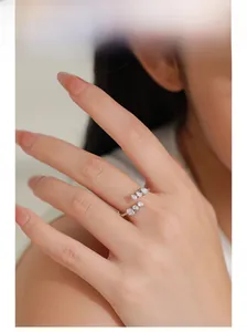 Detail of adjustable S925 silver ring featuring pear-cut cubic zirconia in staggered setting