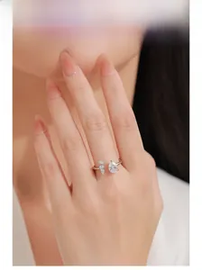Close-up of S925 silver adjustable open ring with pear-shaped zircon on model hand