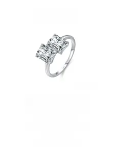Detailed macro view of S925 sterling silver band with dual radiant cut zircon stones