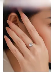 Close-up of minimalist S925 sterling silver ring with single zircon on hand